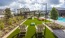 Gaming lawn next to the pool area with bistro lighting