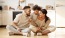 a family inside a bright room