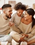 a family sitting on the floor