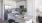 a kitchen with white cabinets